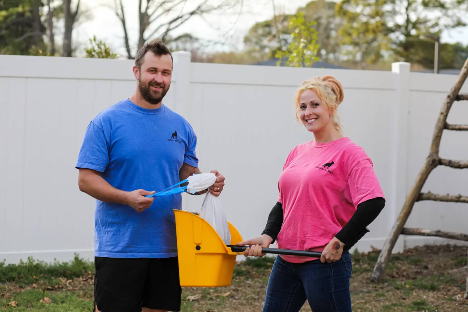 Doggy Scoop team members with cleanup equipment